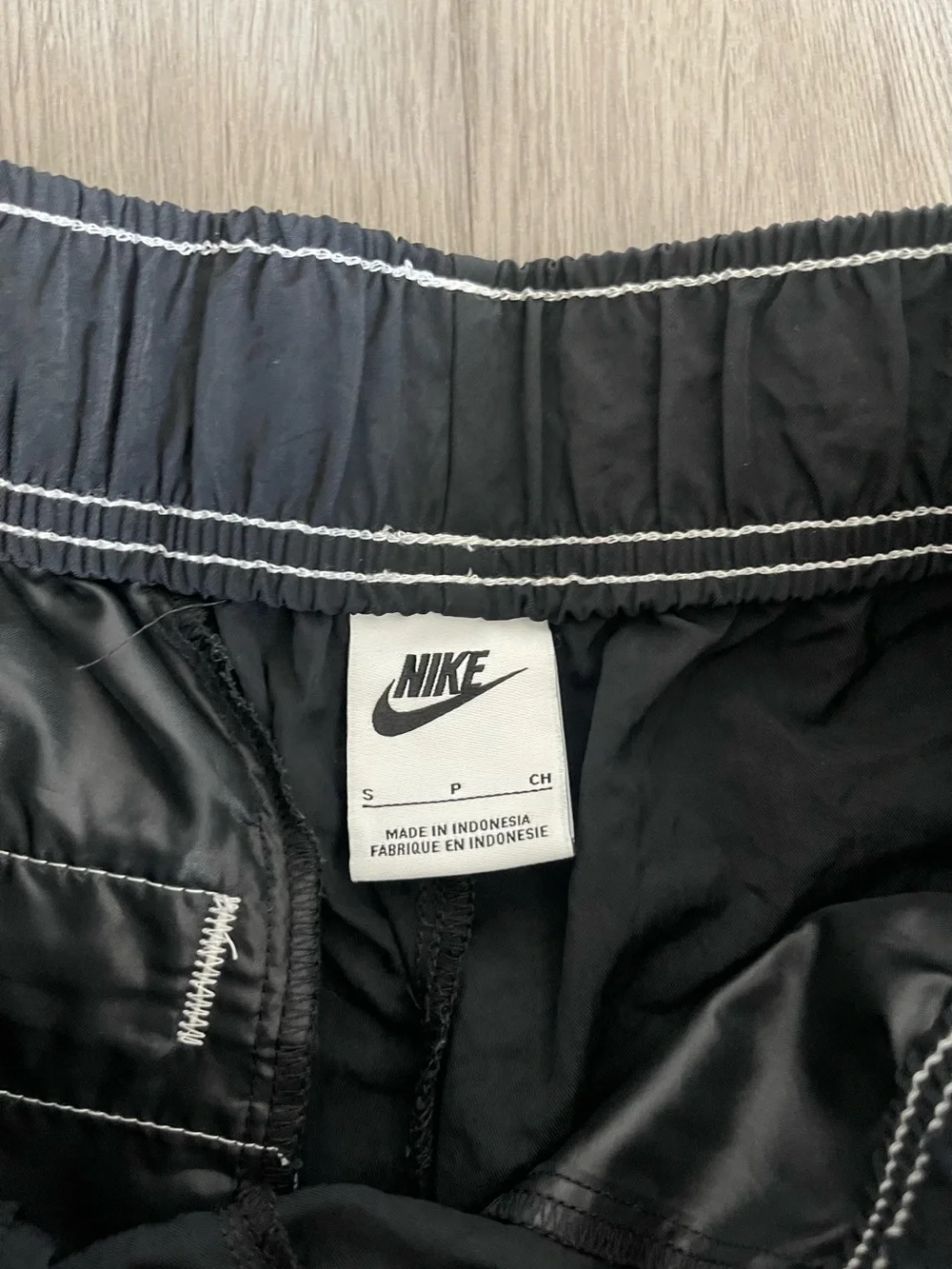 Nike Black Athletic Shorts with White Swoosh Accent